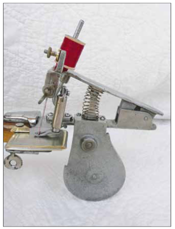 Side view of the Beckwith 12 dollar sewing machine.