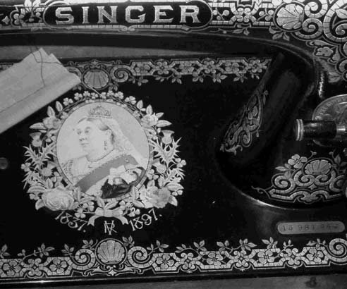 Queen Victoria on bed of Singer Sewing Machine