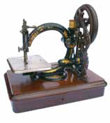 Small picture of a Willcox and Gibbs chainstitch sewing machine.