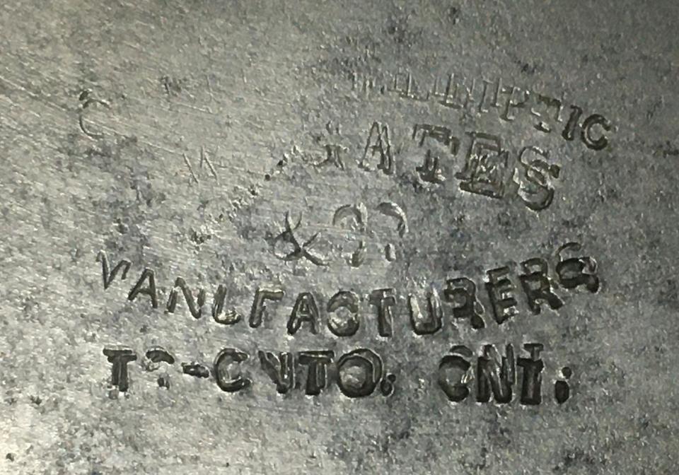 The ‘Queen’s Elliptic’ chainstitch machine, Gates’s die stamp on the cloth plate. The workman did not hold the stamp square-on and the hammer bounced! (HB)