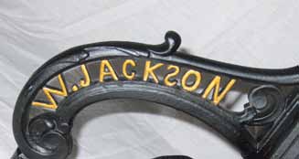 Single-pillar William Jackson sewing machine stand with the 'S' in Jackson's name reversed