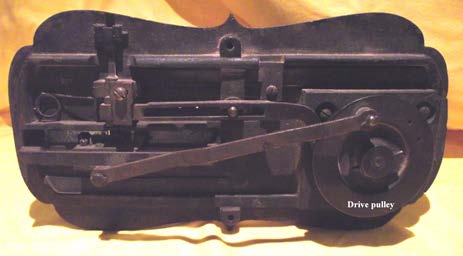 Drive pulley on the underside of the Kimball and Morton Lion Sewing Machine