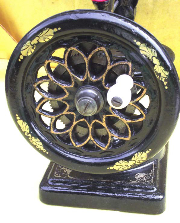 Open Flywheel of the Nussey and Pilling Little Stranger Sewing Machine