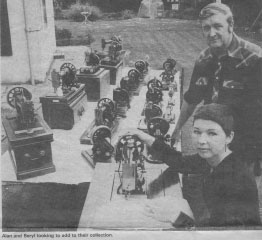 Beryl and Alan and their sewing machine collection.