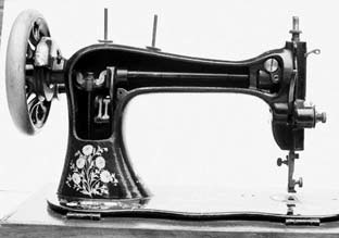 Cut-away of the back of the arm of the Singer Improved Family Sewing Machine
