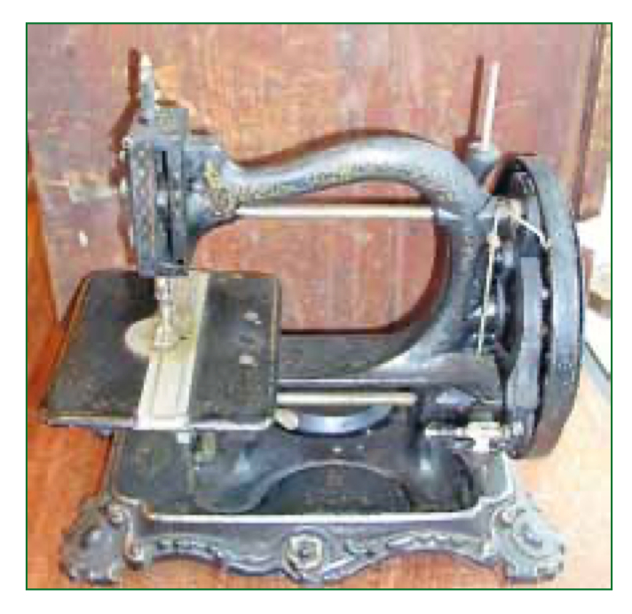 Wanzer Model A Sewing Machine on its decorative cast-iron base